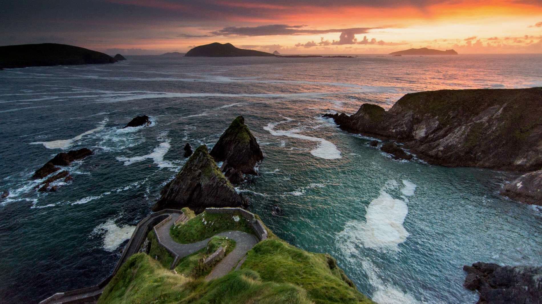 The winding path down to Dunquin Pier and the Blasket Islands at sunset, Co. Kerry